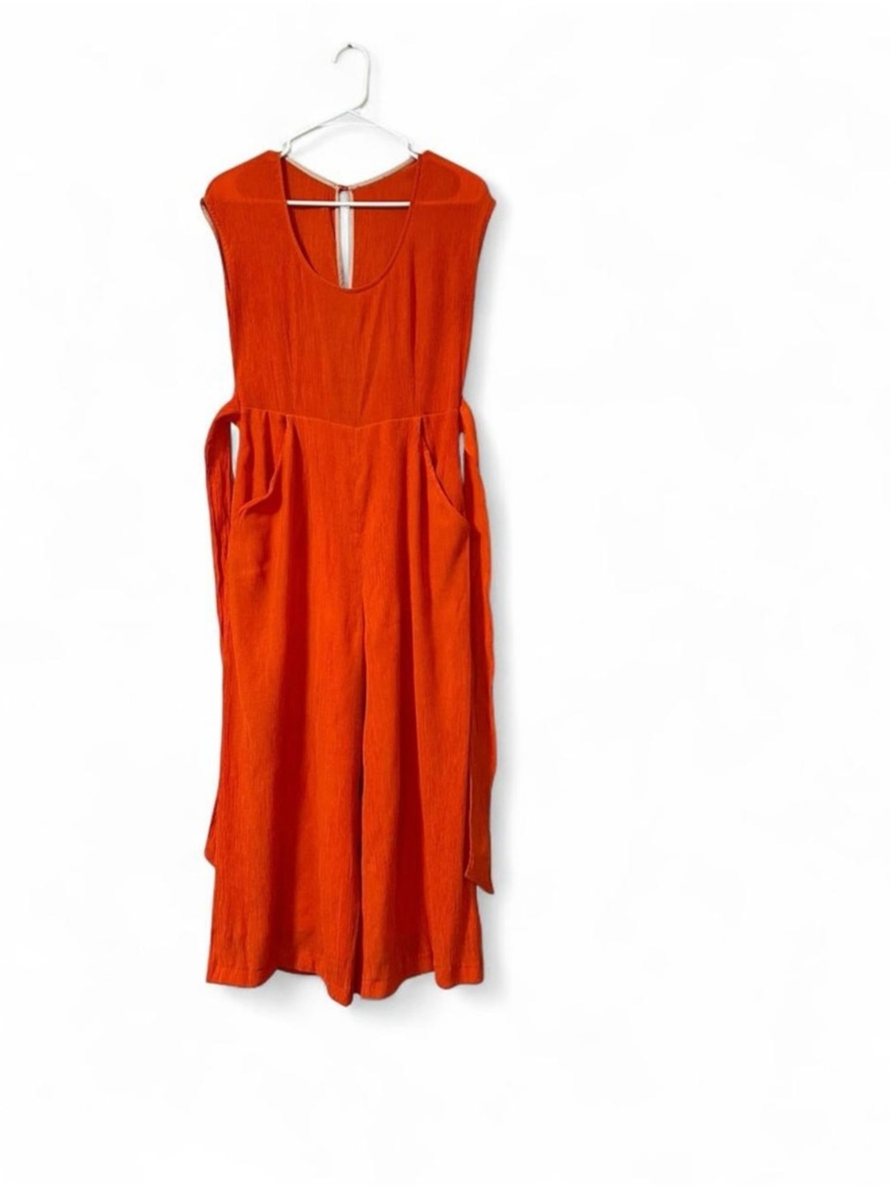 Anthropologie Bright Orange Sleeveless Jumpsuit with Side Tie Detail. Size S-M